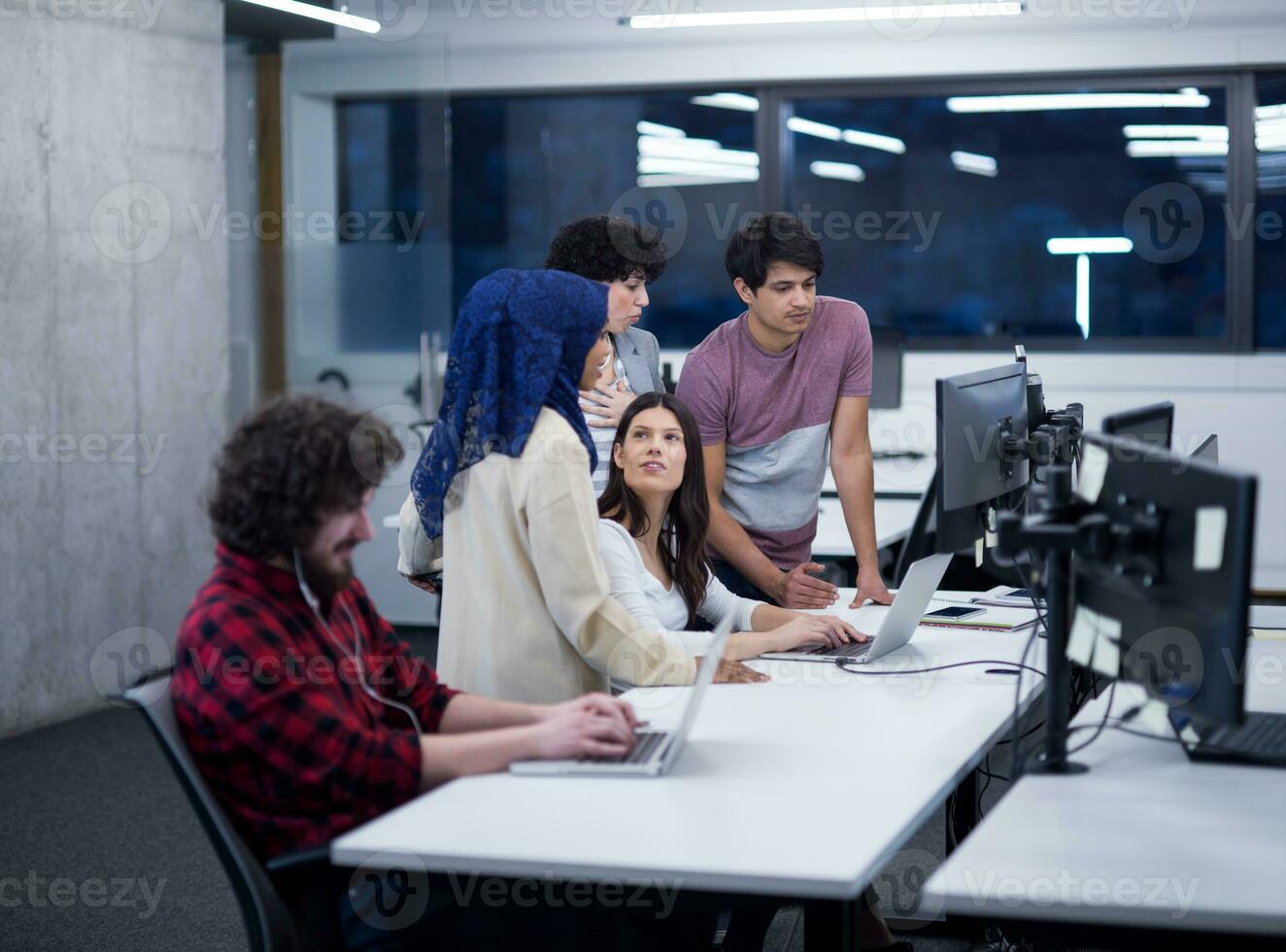 multiethnics team of software developers working together photo