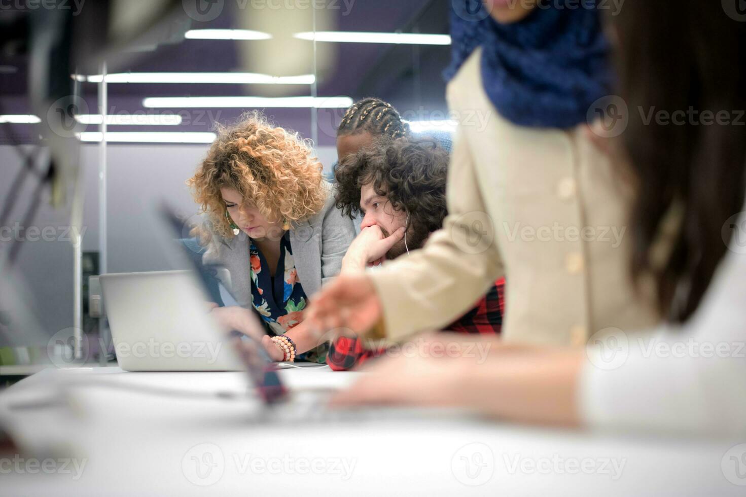multiethnics team of software developers working together photo