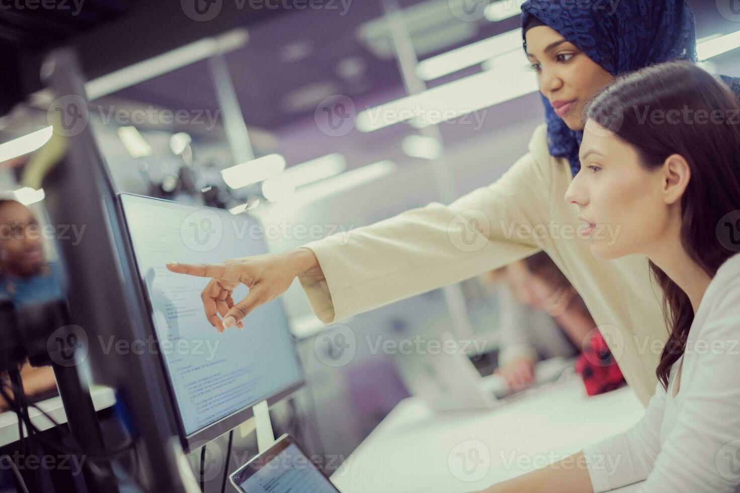 multiethnics team of software developers working together photo