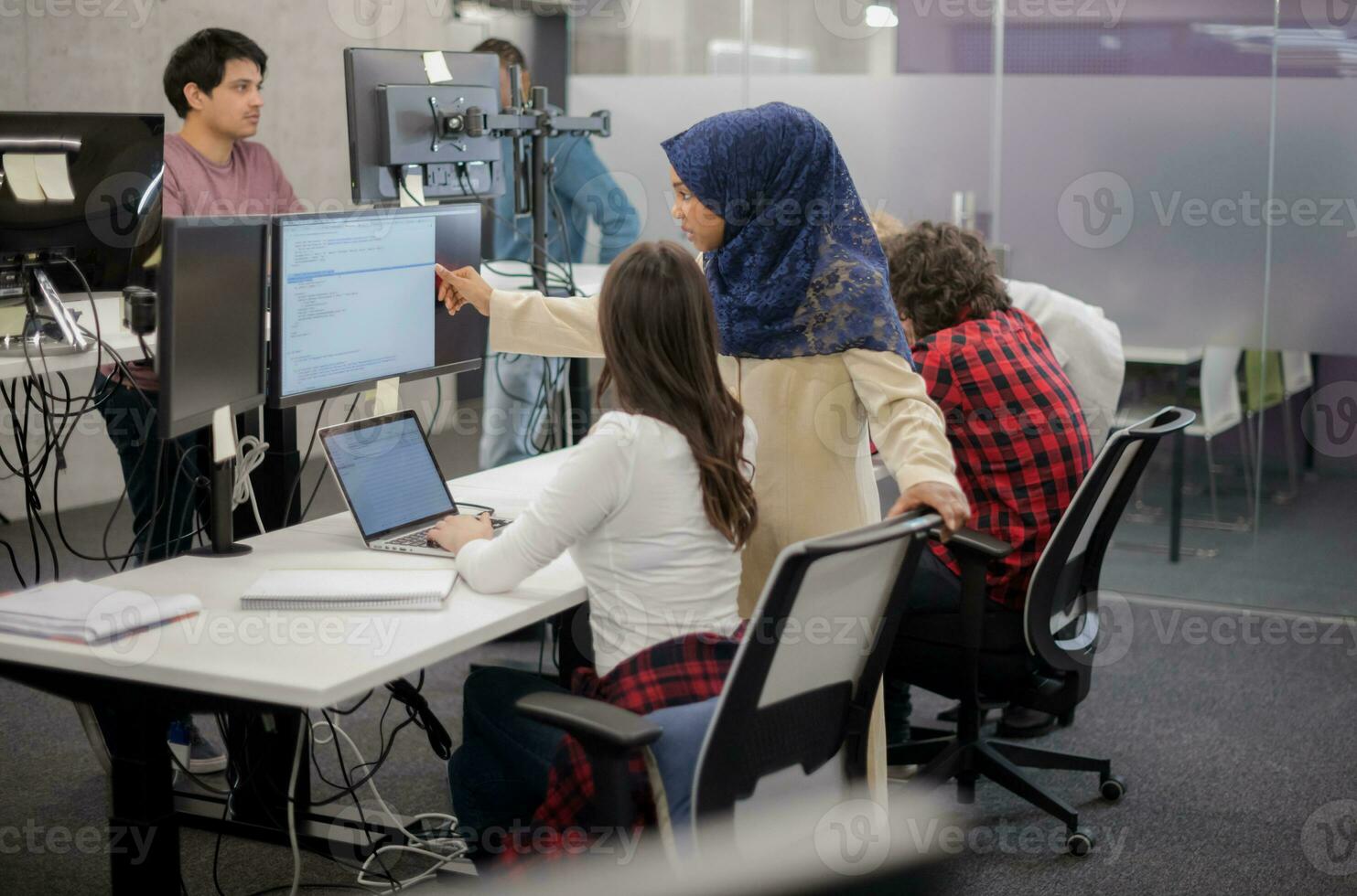 multiethnics team of software developers working together photo