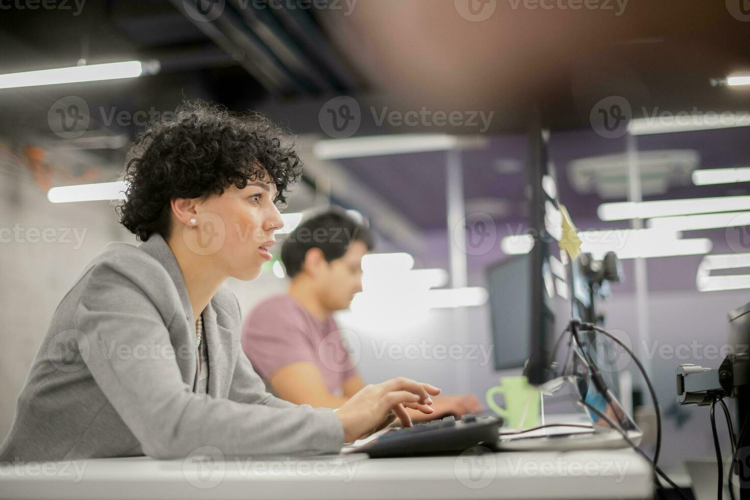 female software developer using desktop computer photo