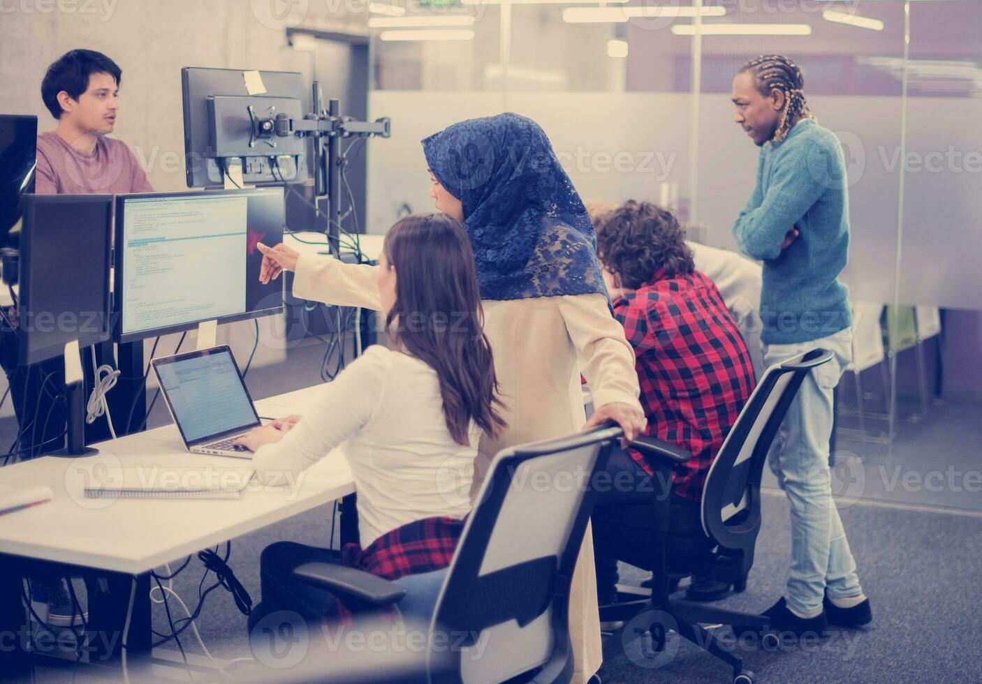 multiethnics team of software developers working together photo