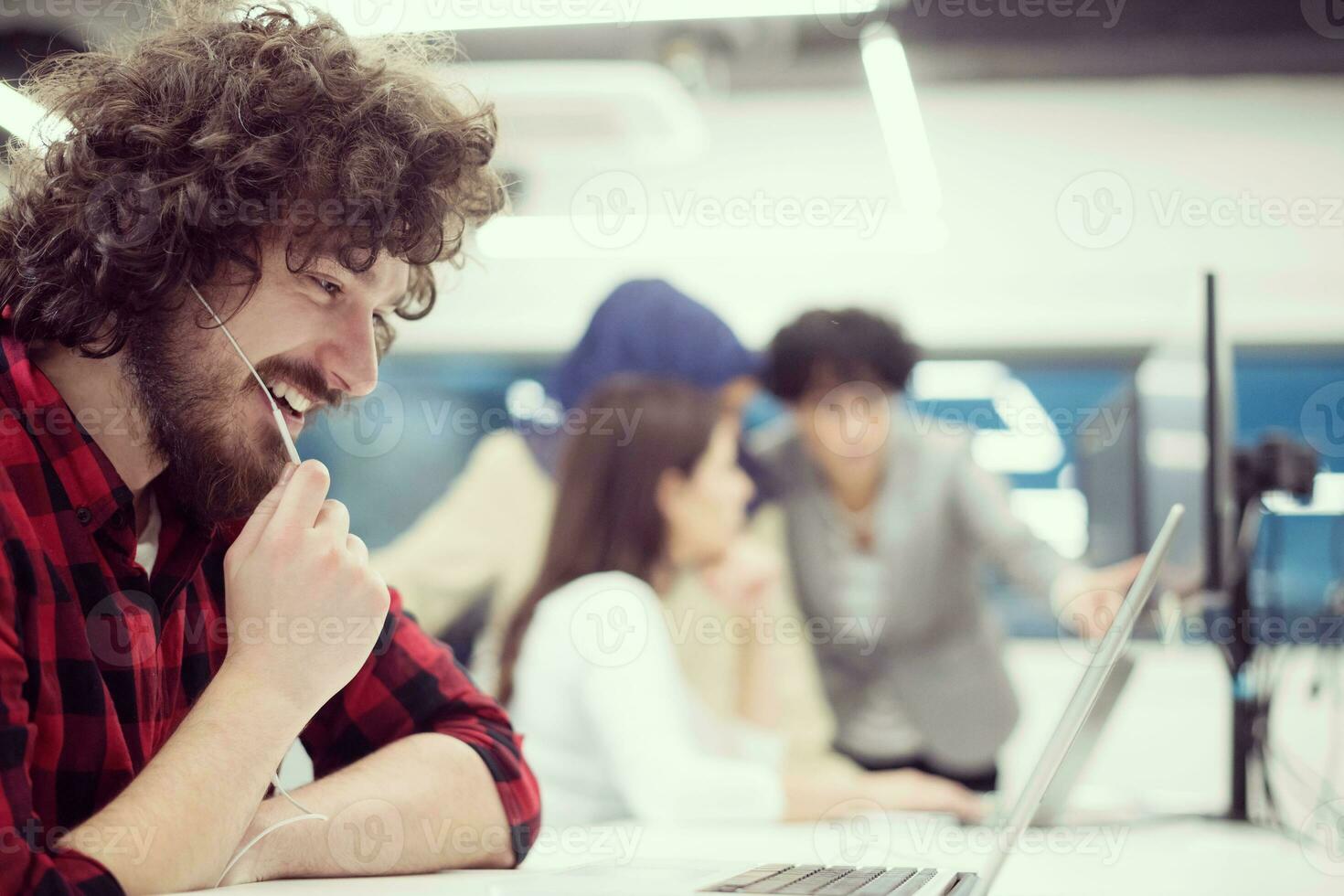 young multiethnics team of software developers working together photo