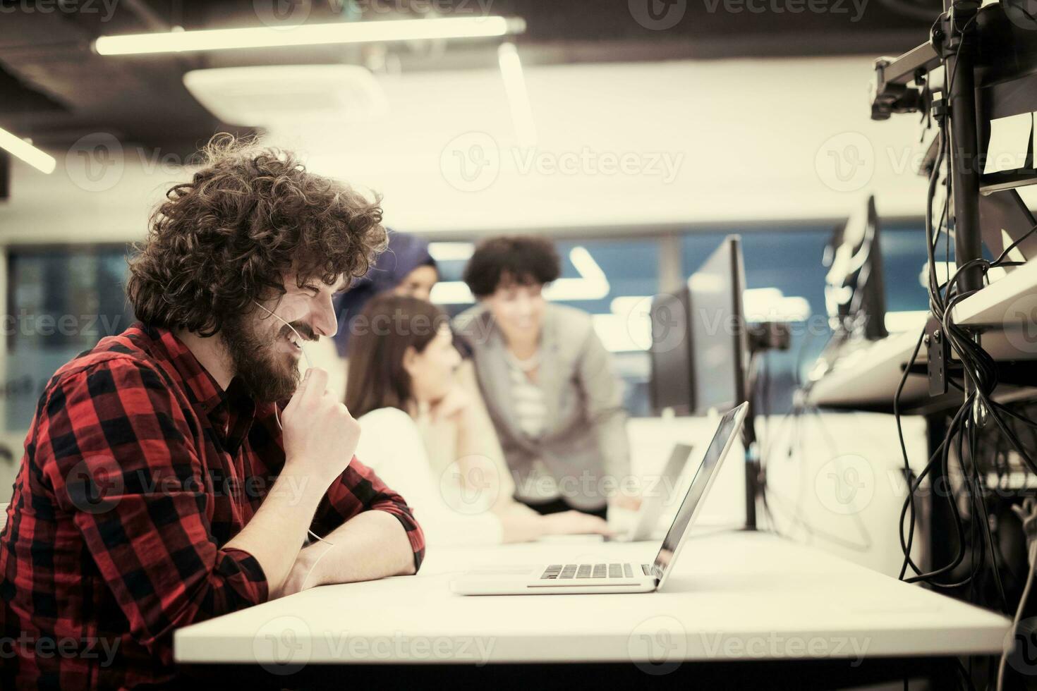young multiethnics team of software developers working together photo