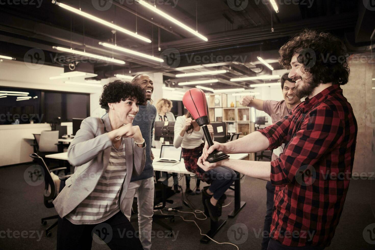 multiethnics business team boxing at office photo