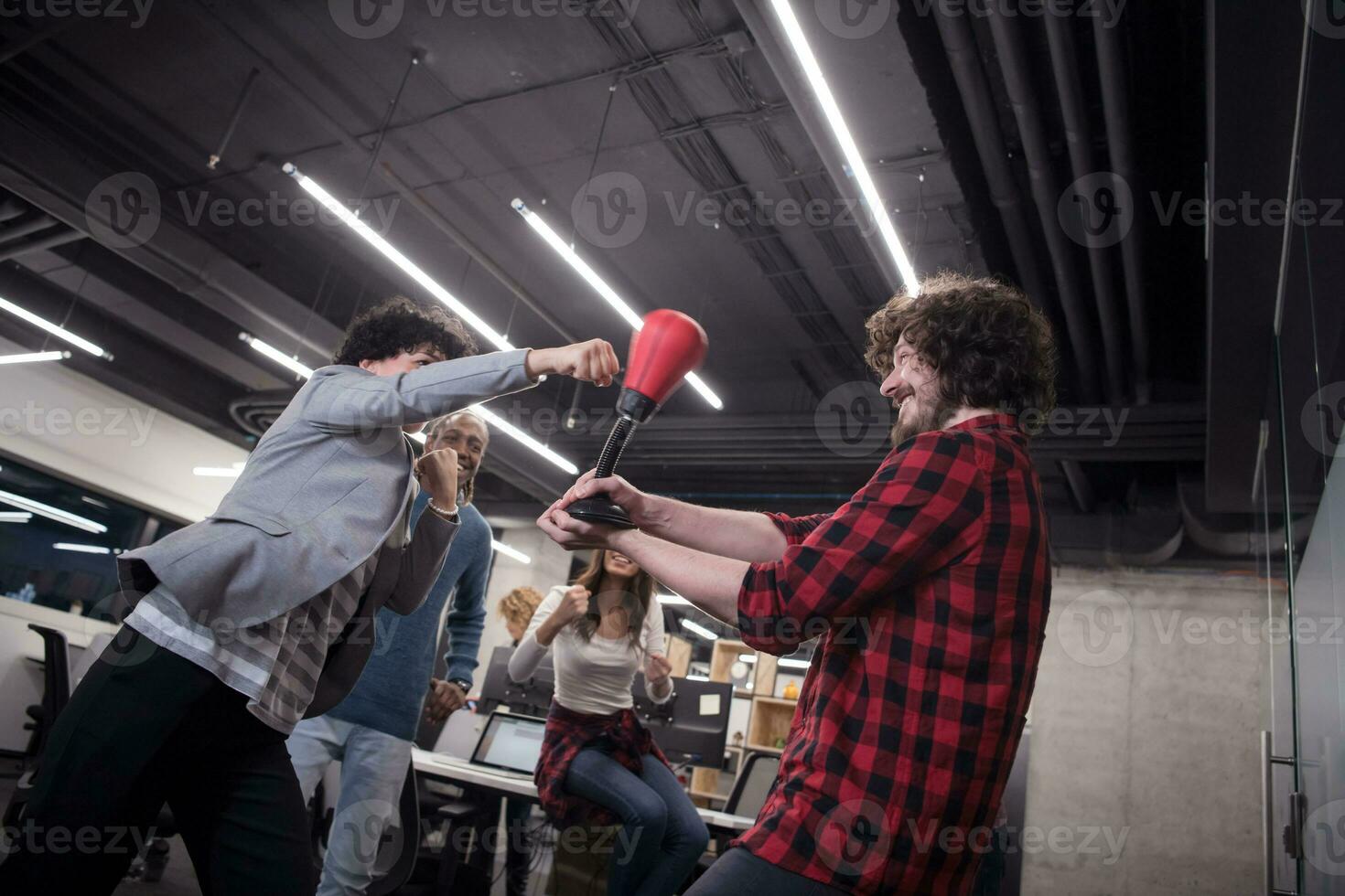 multiethnics business team boxing at office photo