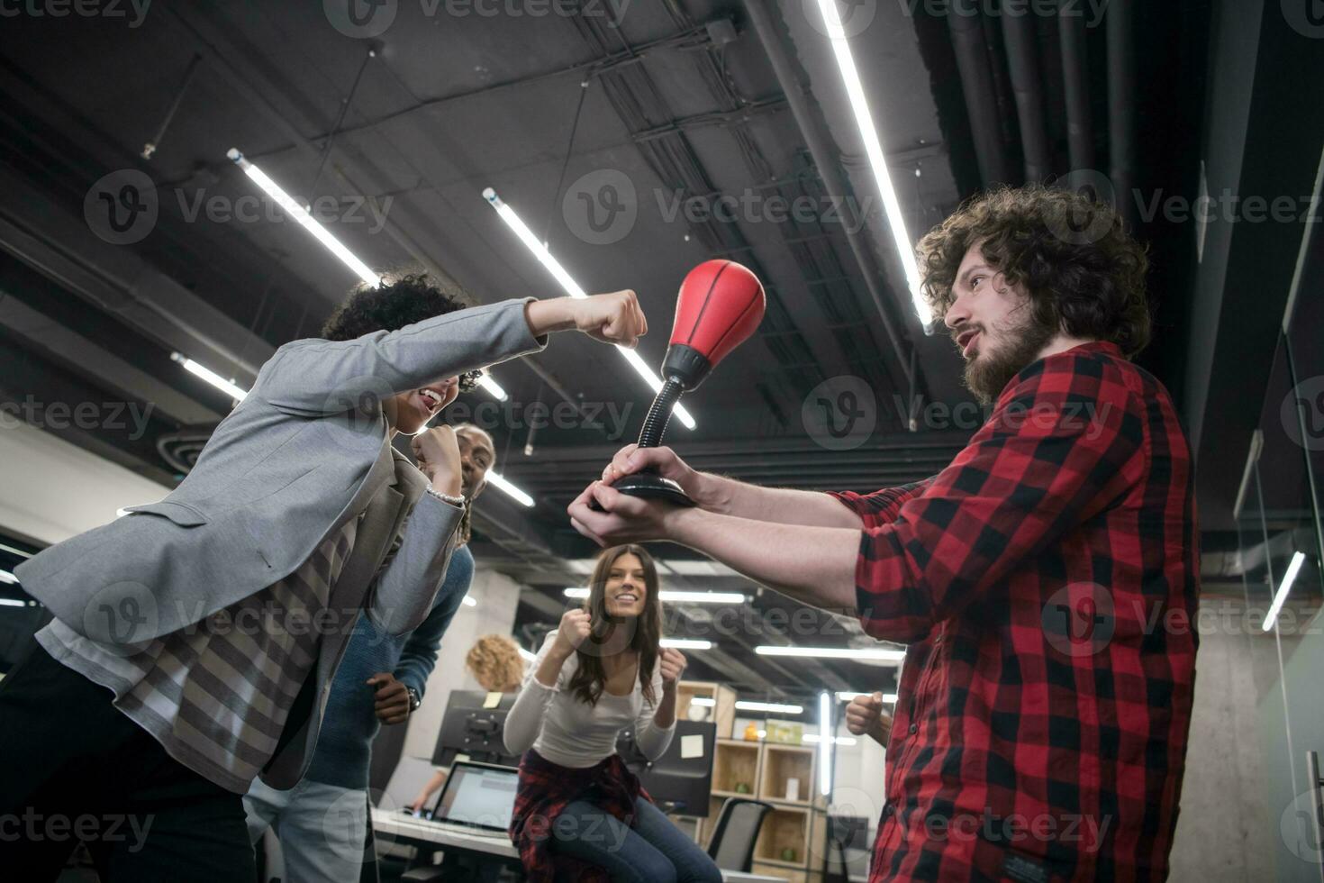 multiethnics business team boxing at office photo