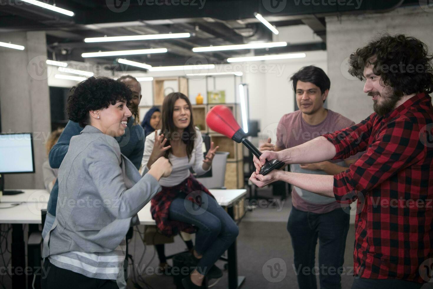 multiethnics business team boxing at office photo