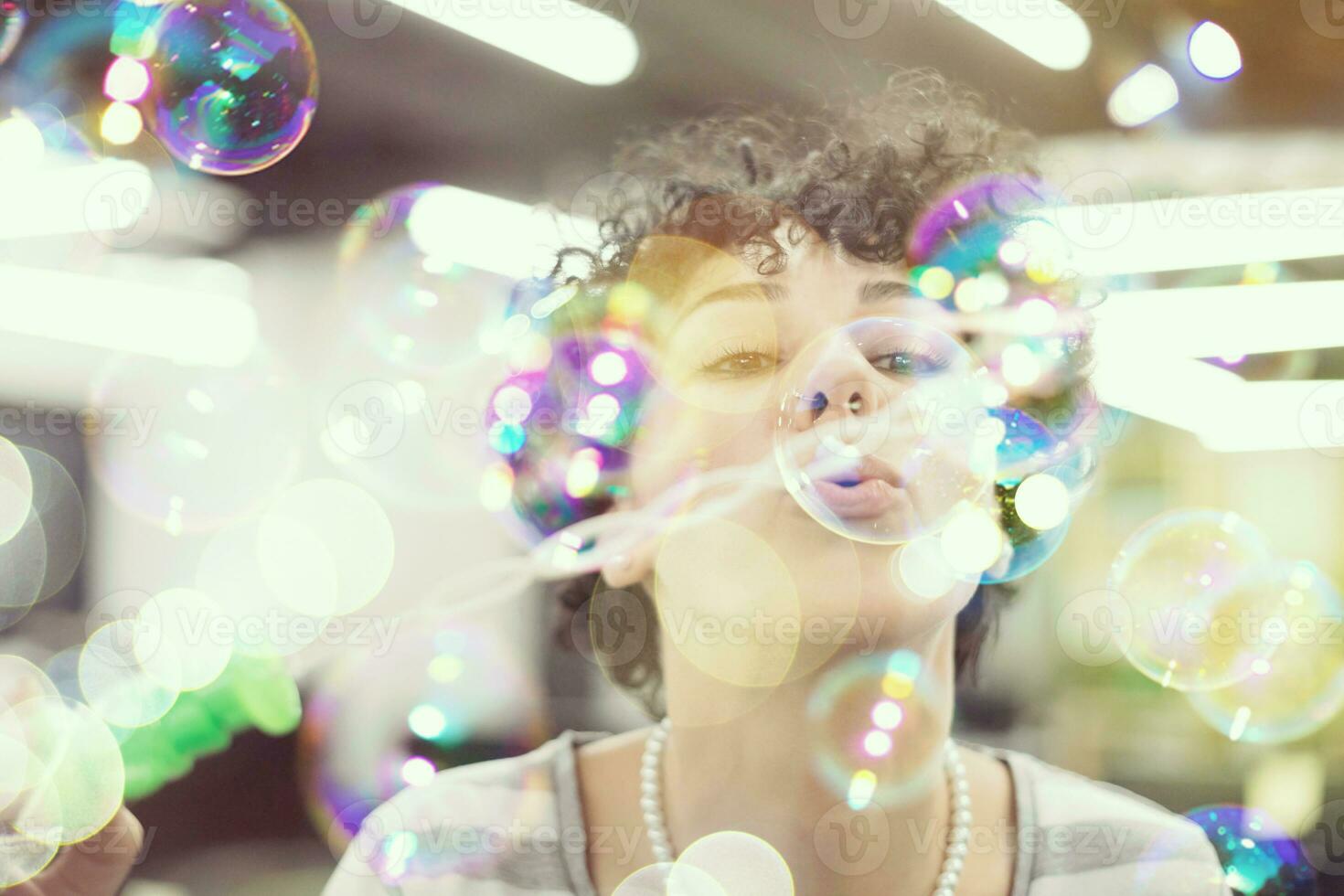 software developer having fun while making soap bubble photo