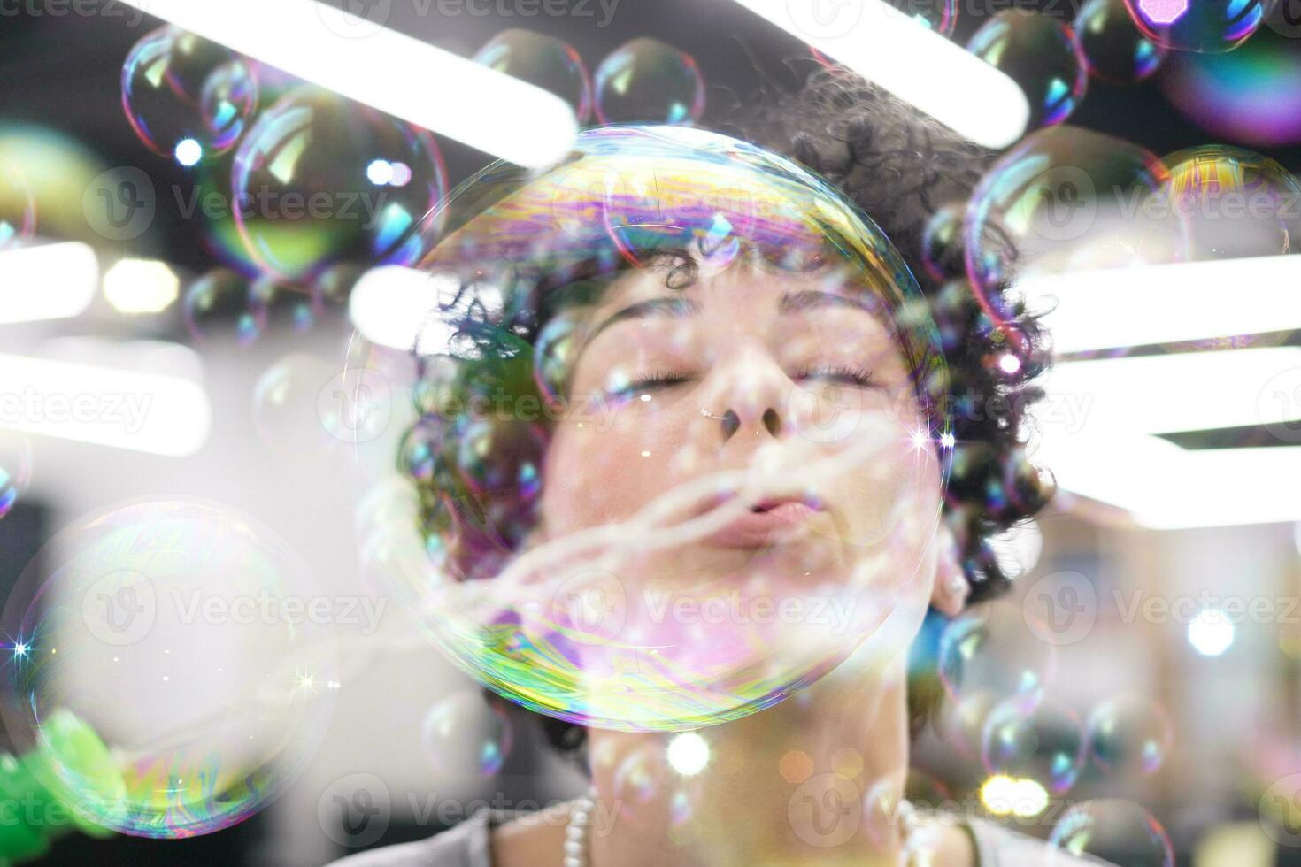 software developer having fun while making soap bubble photo