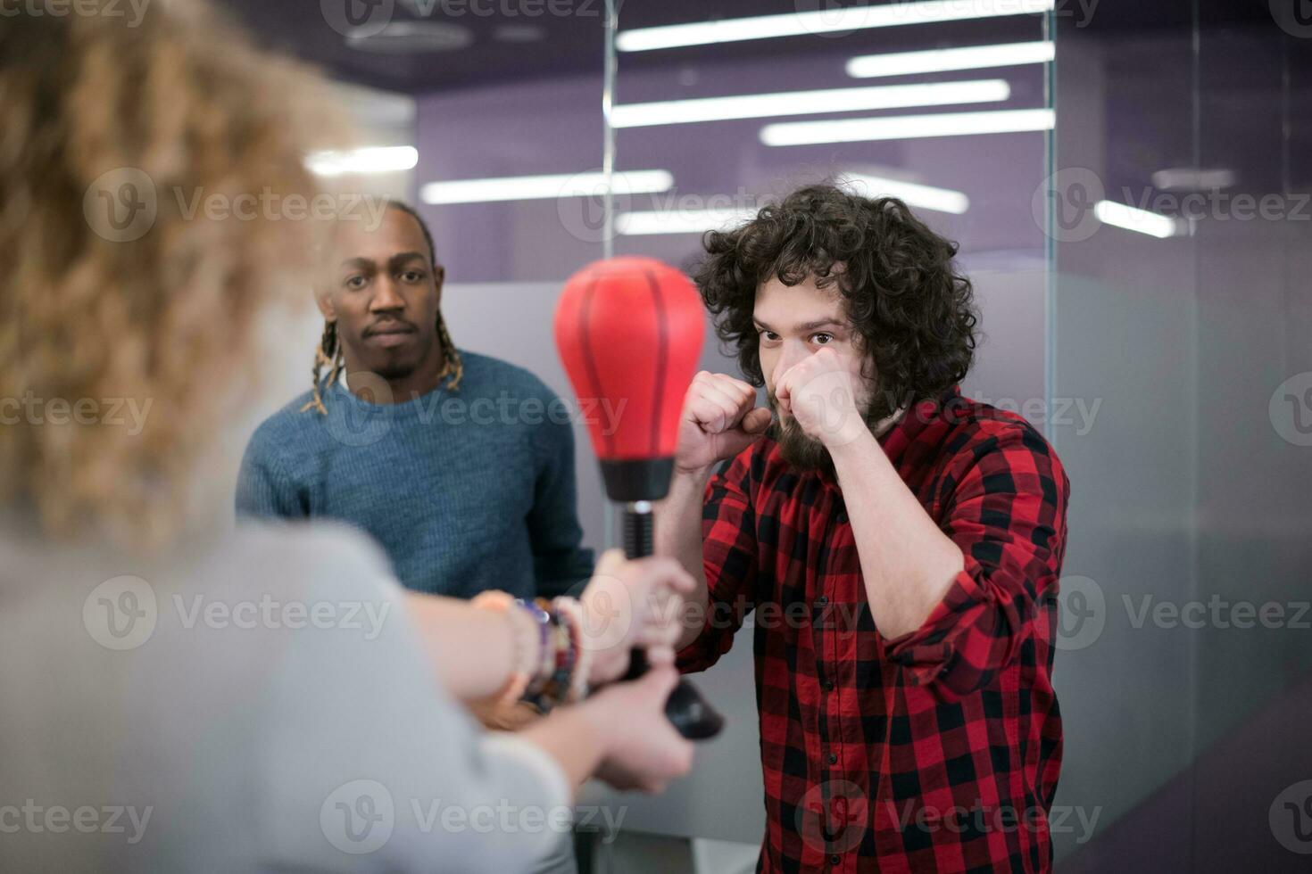 multiethnics business team boxing at office photo