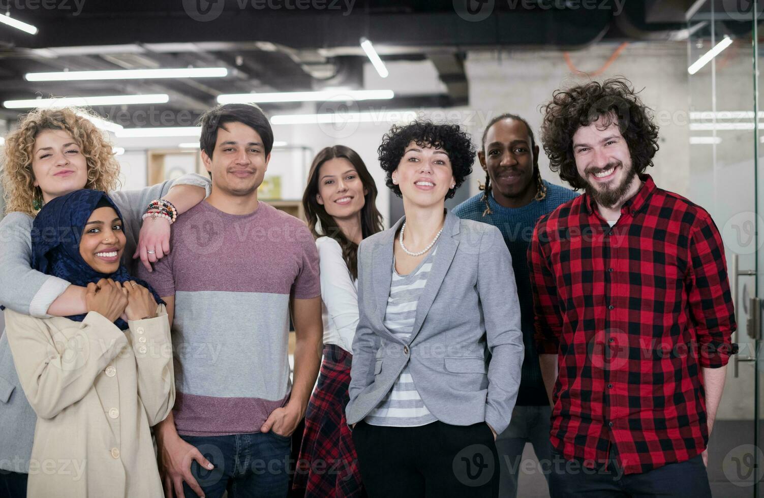 portrait of young excited multiethnics business team photo