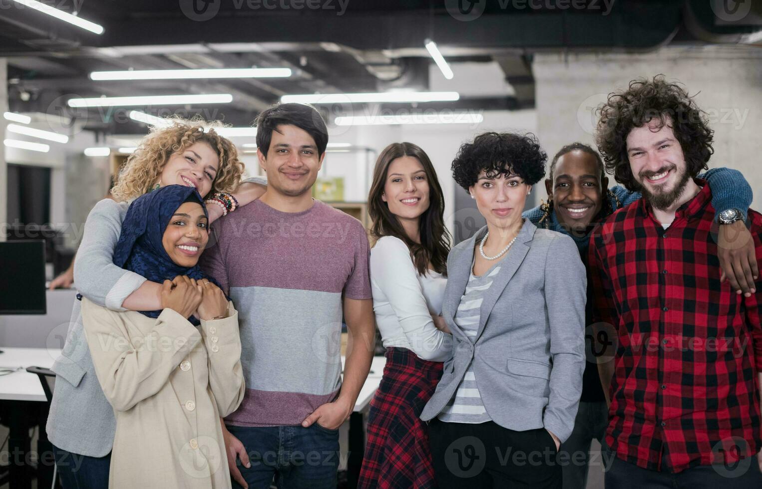 portrait of young excited multiethnics business team photo