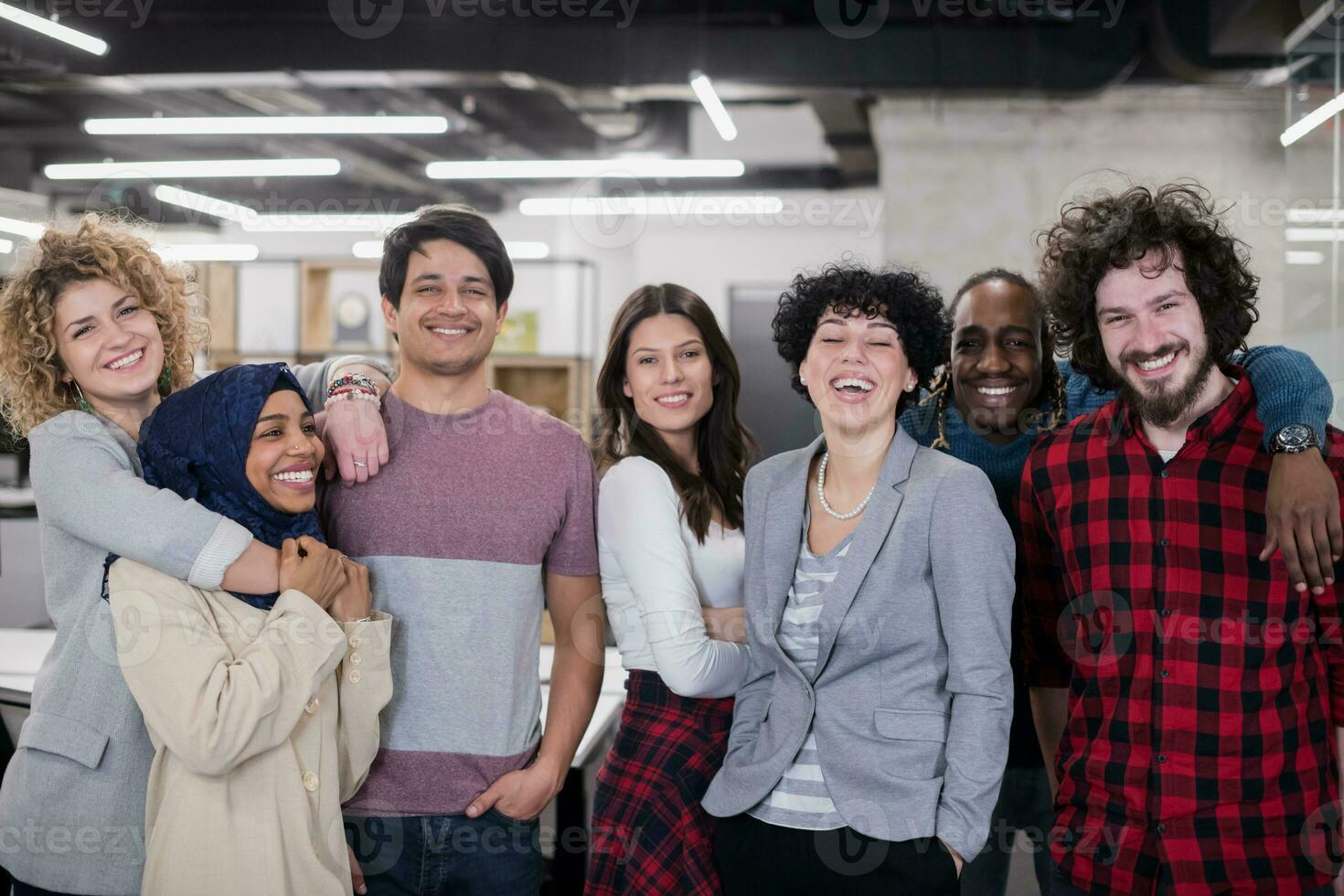 portrait of young excited multiethnics business team photo