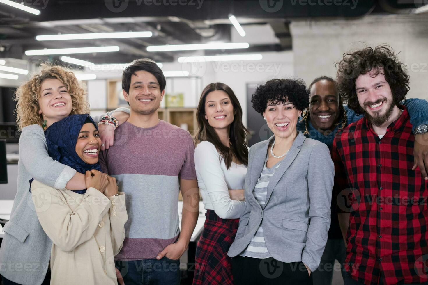 portrait of young excited multiethnics business team photo