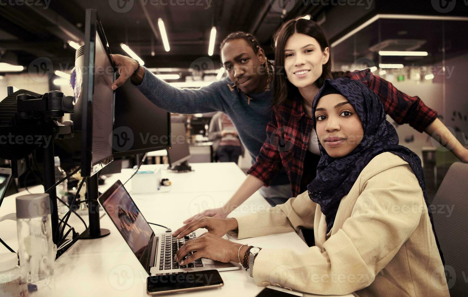 multiethnics team of software developers working together photo