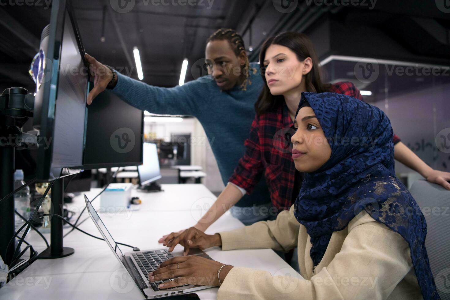 multiethnics team of software developers working together photo