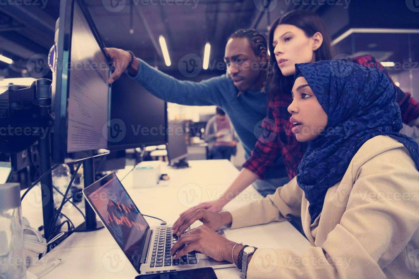 multiethnics team of software developers working together photo
