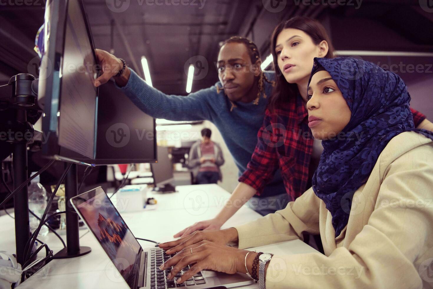 multiethnics team of software developers working together photo