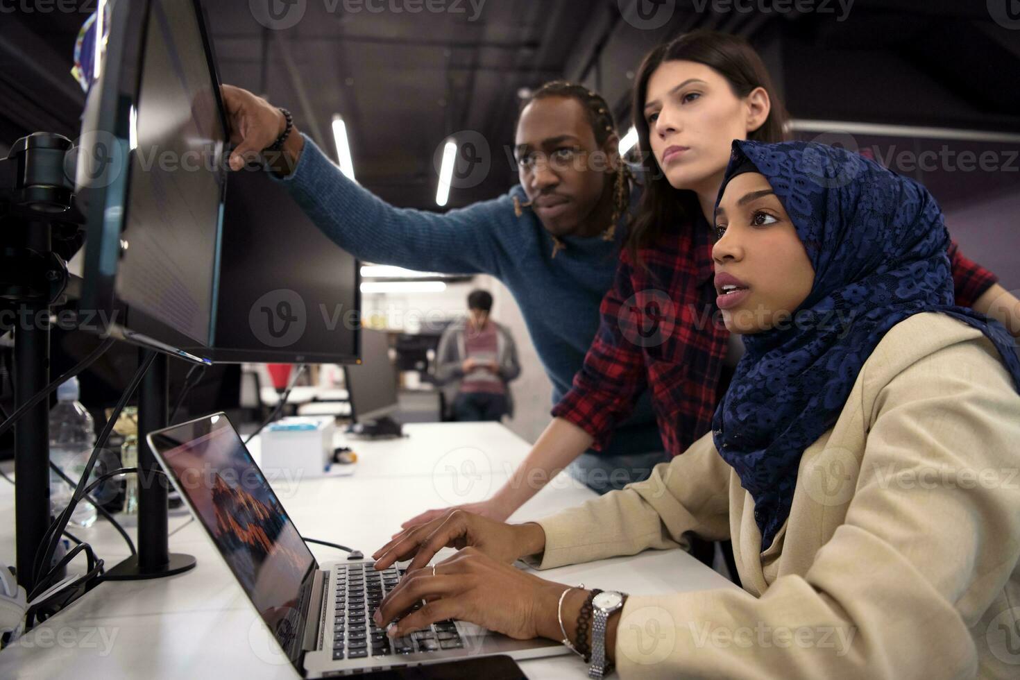 multiethnics team of software developers working together photo
