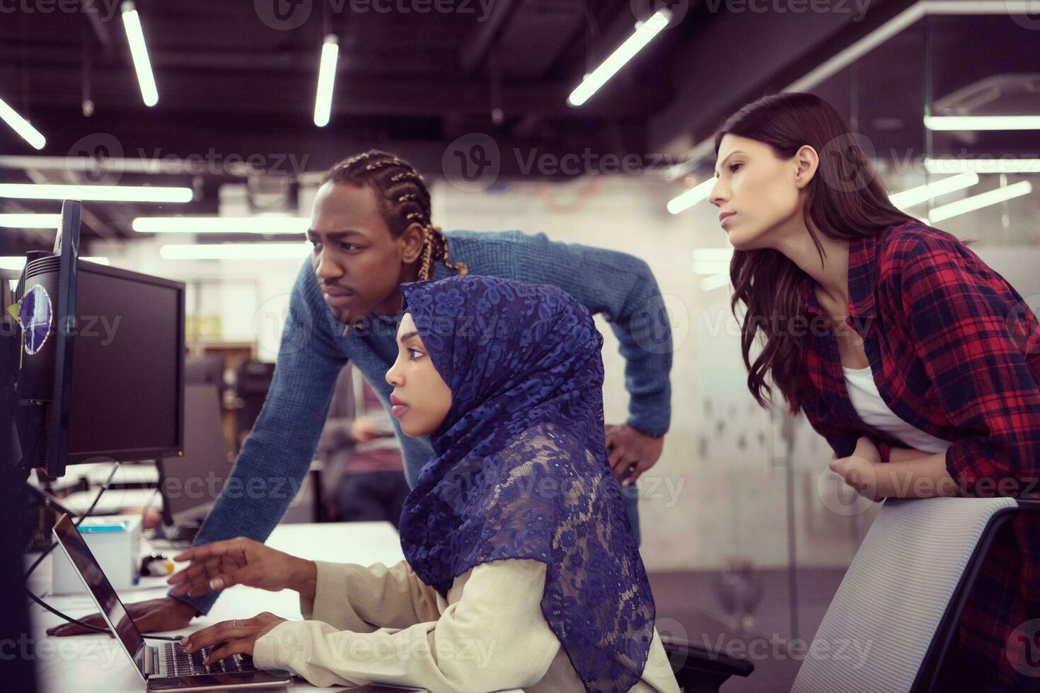 multiethnics team of software developers working together photo