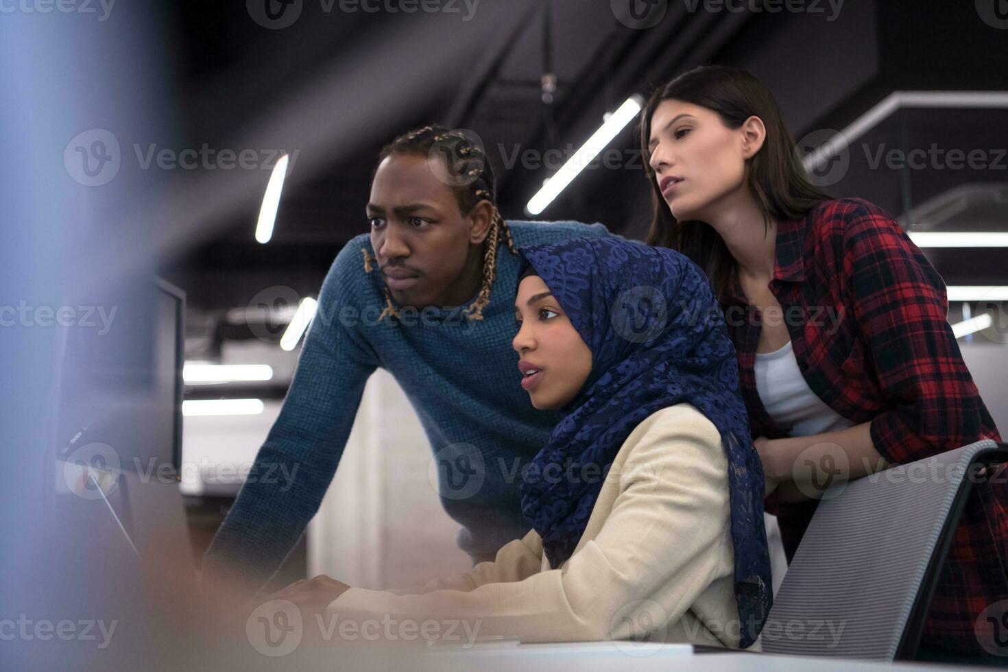 multiethnics team of software developers working together photo