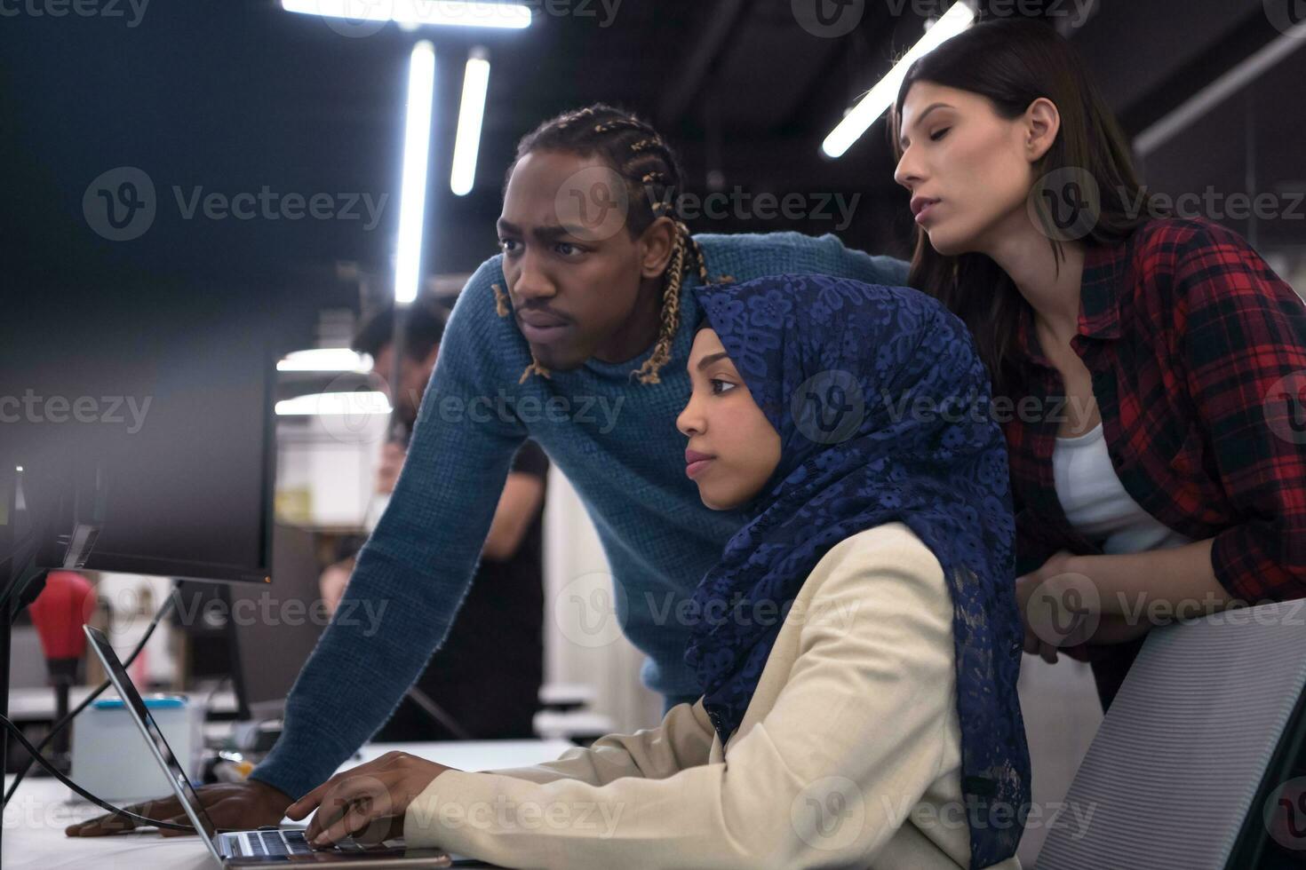 multiethnics team of software developers working together photo