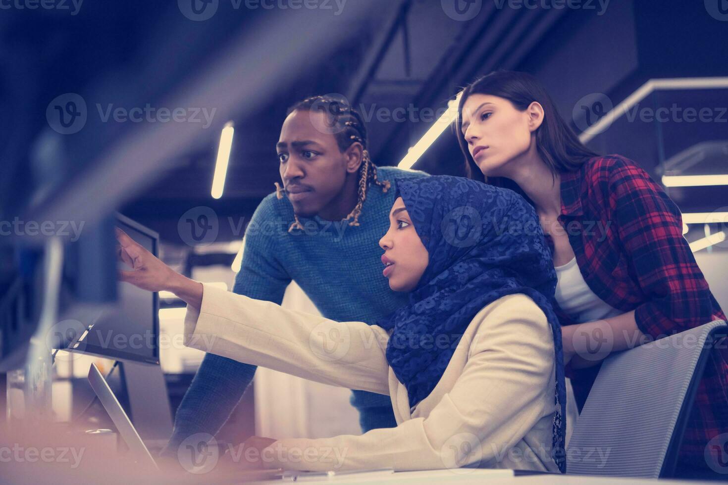 multiethnics team of software developers working together photo
