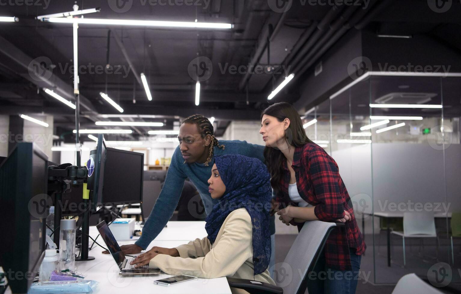 multiethnics team of software developers working together photo