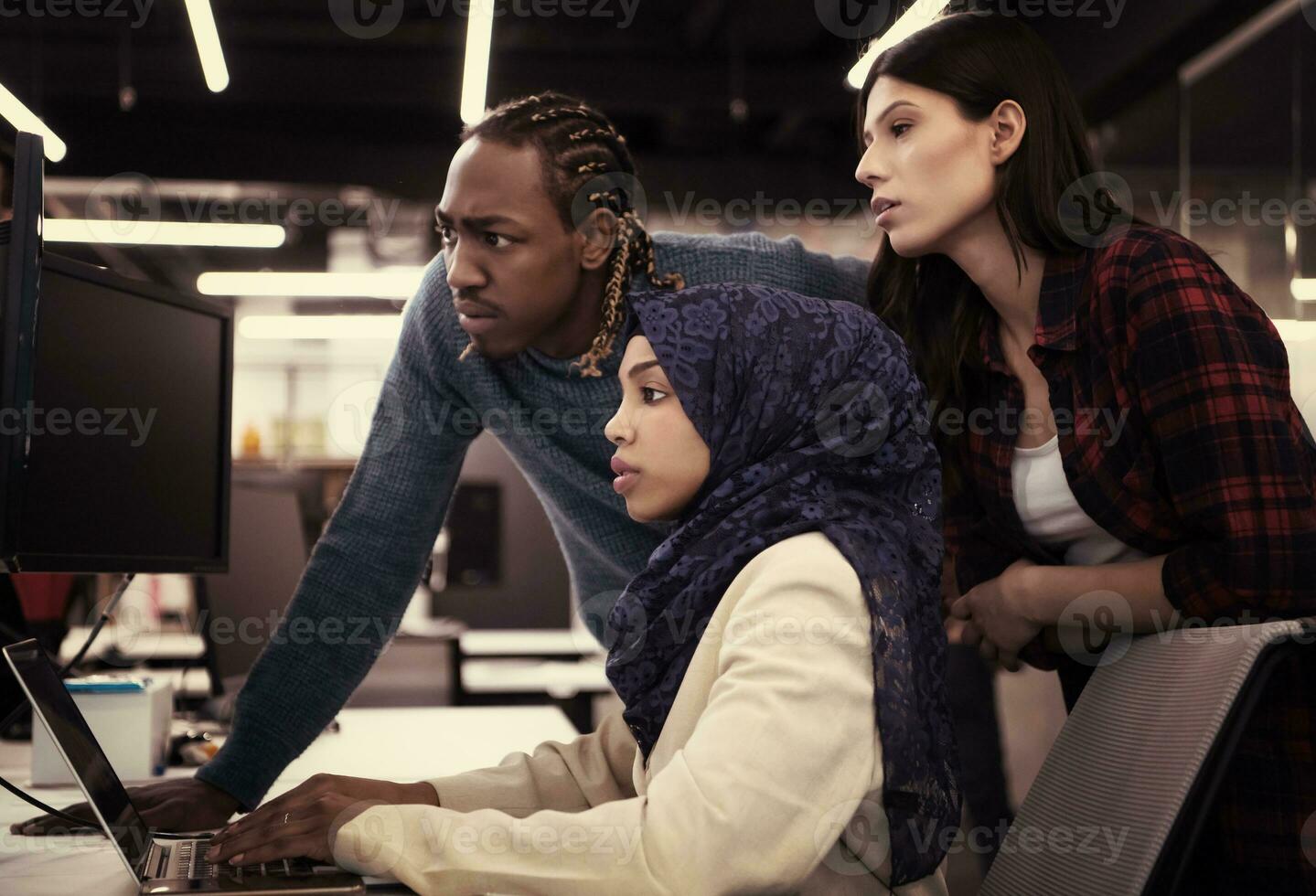 multiethnics team of software developers working together photo