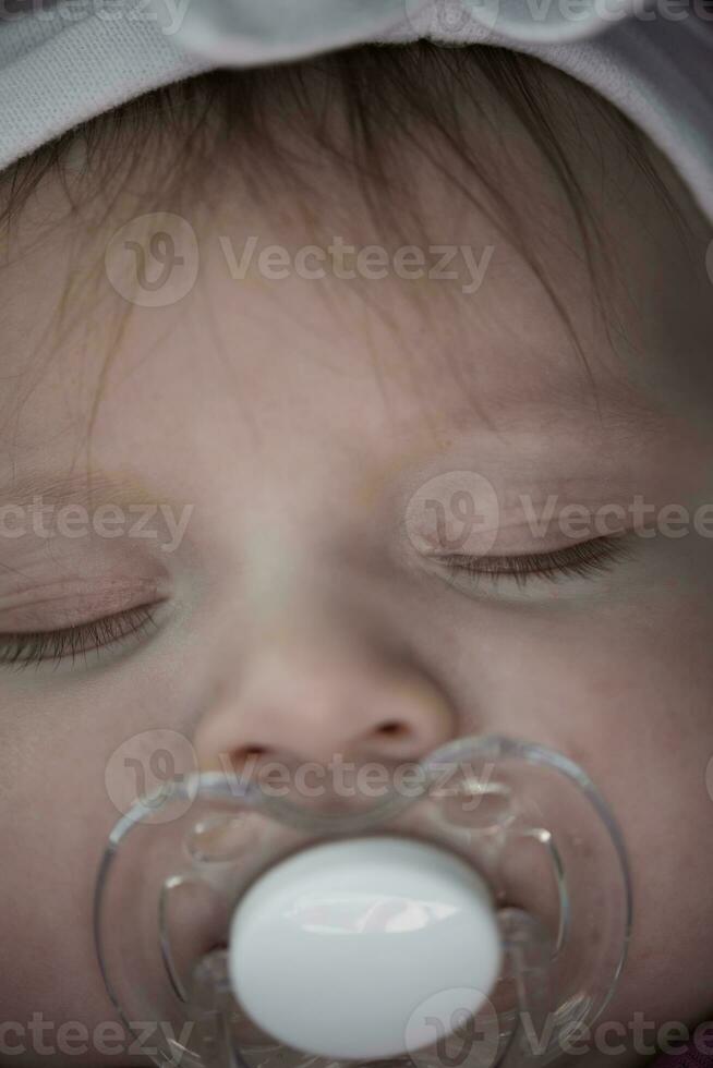 newborn baby sleeping  at home in bed photo