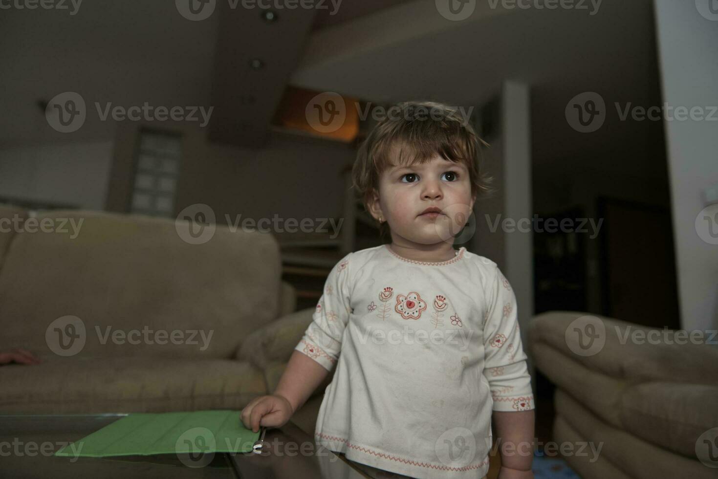 Adorable cute beautiful little baby girl playing with toys at home photo