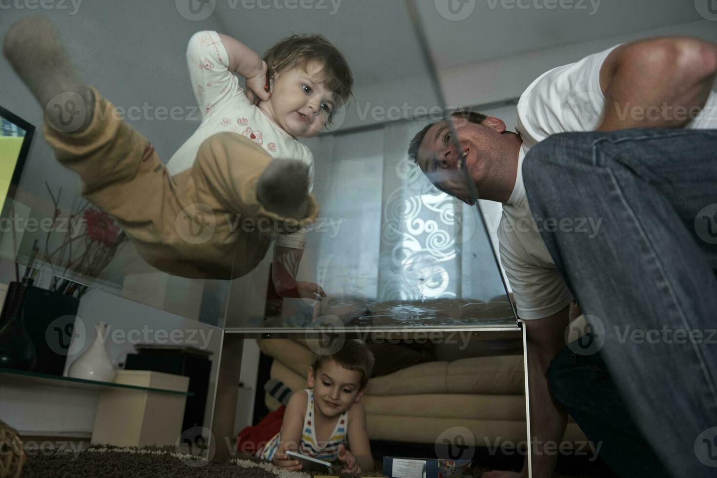 Little child playing  with sister at home photo