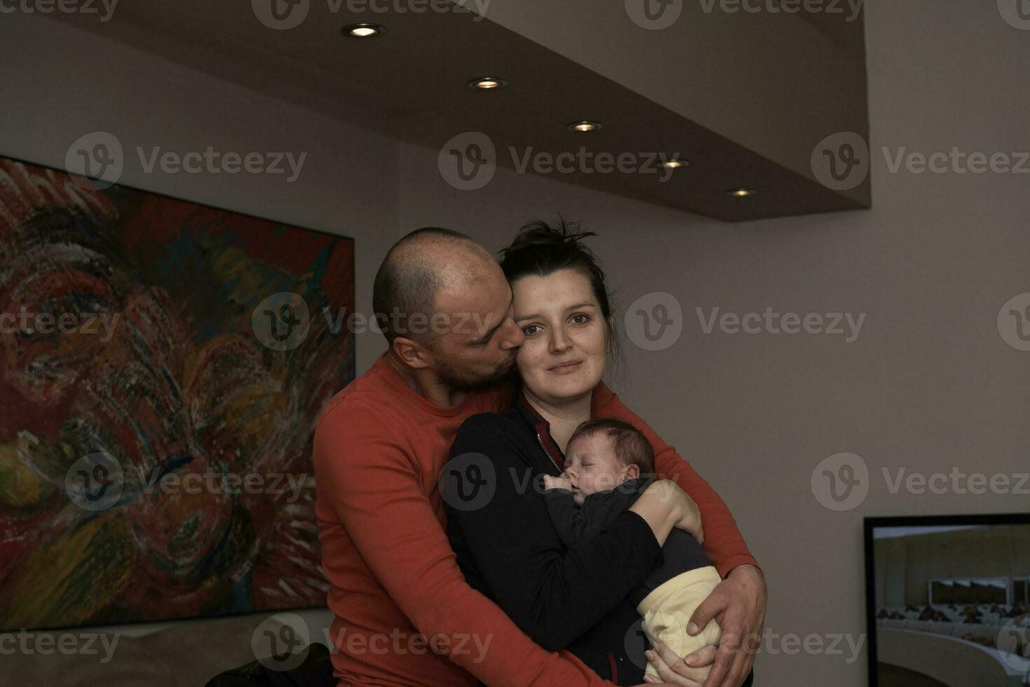 young family portrait with newborn baby photo