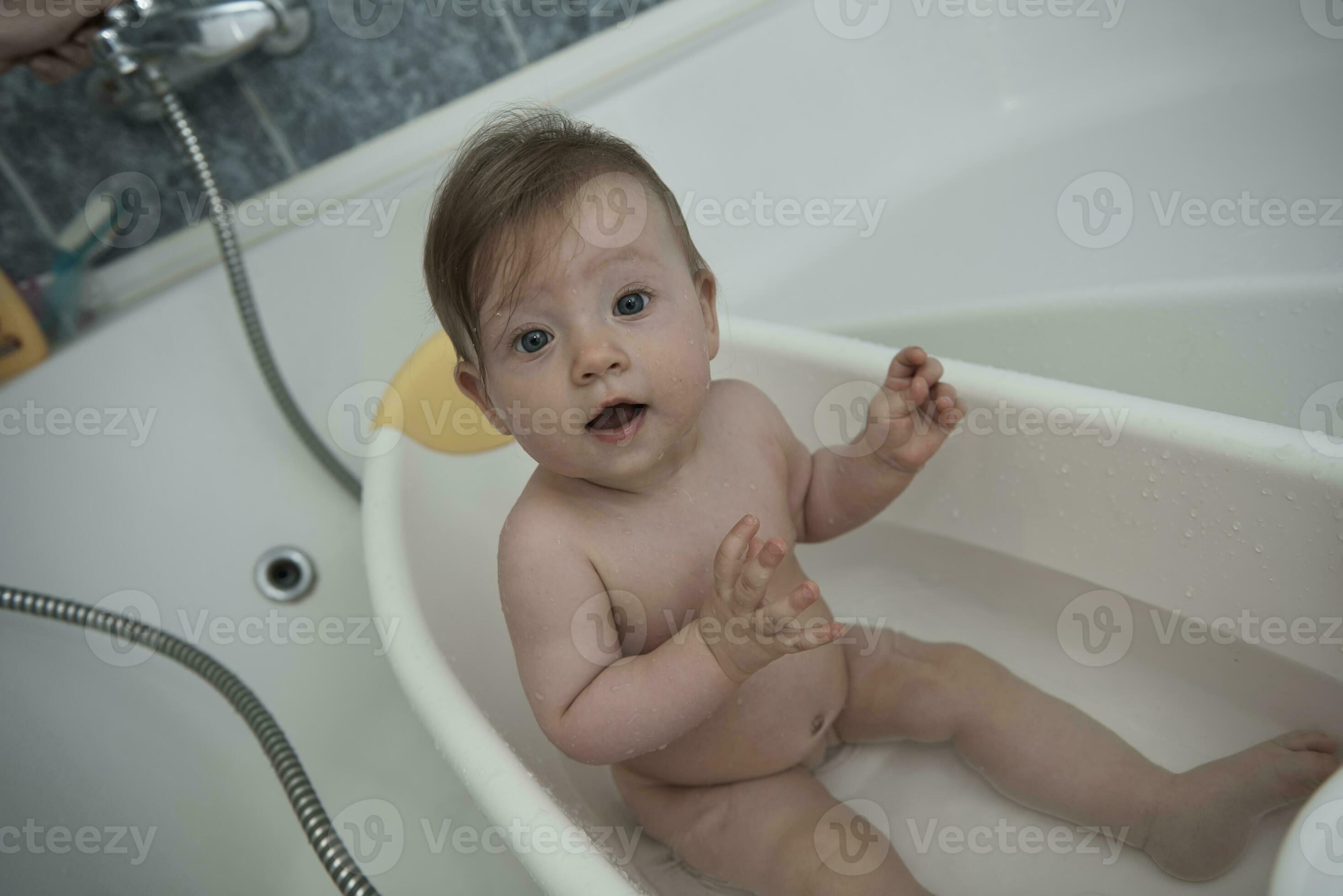 cute little baby girl taking a bath 31023498 Stock Photo at Vecteezy
