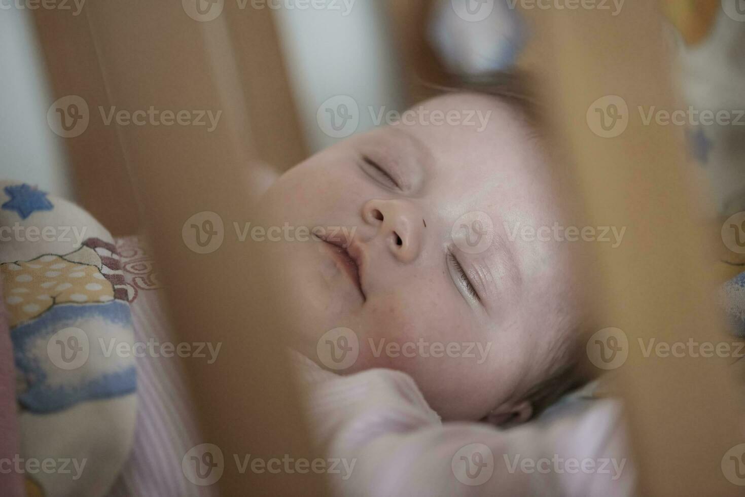 newborn baby sleeping  at home in bed photo