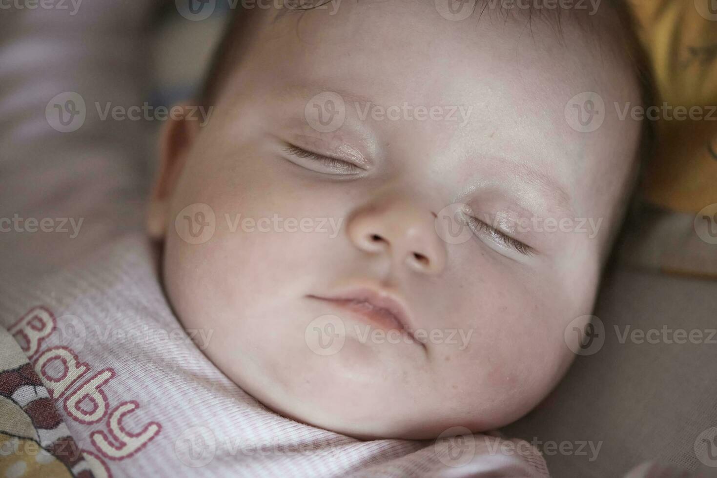 newborn baby sleeping  at home in bed photo