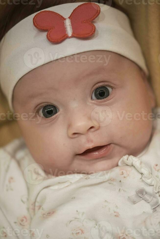 portrait of happy newborn little baby smilling photo