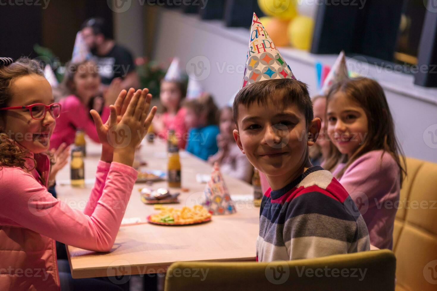 The young boy joyfully celebrating his birthday photo