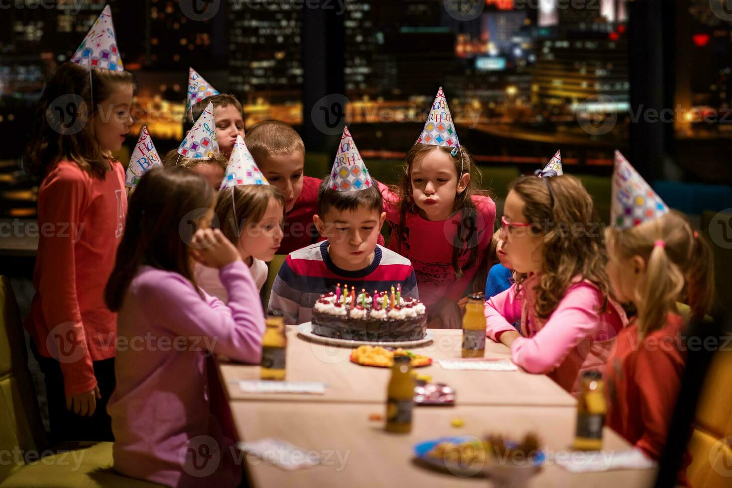 happy young boy having birthday party photo