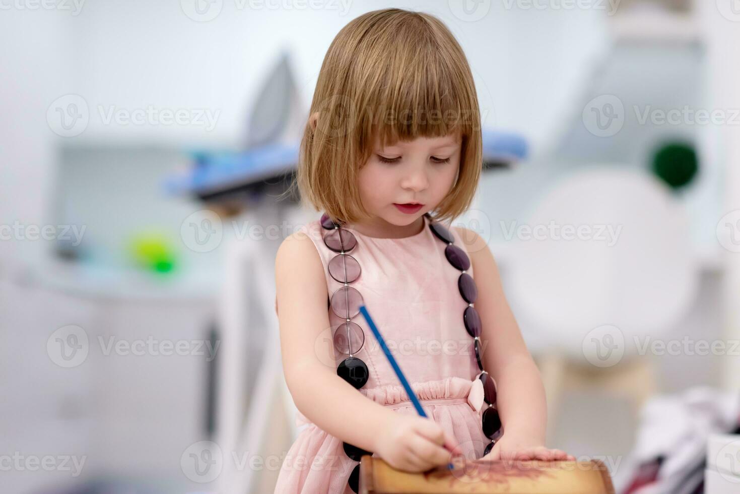 little girl painting jewelry box photo