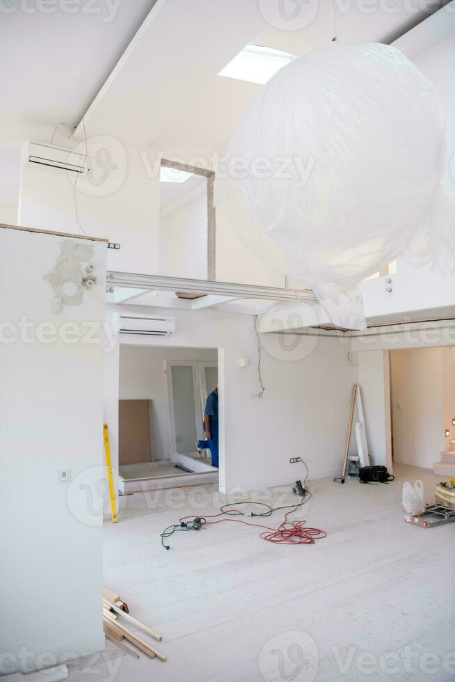 carpenters installing glass door with a wooden frame photo