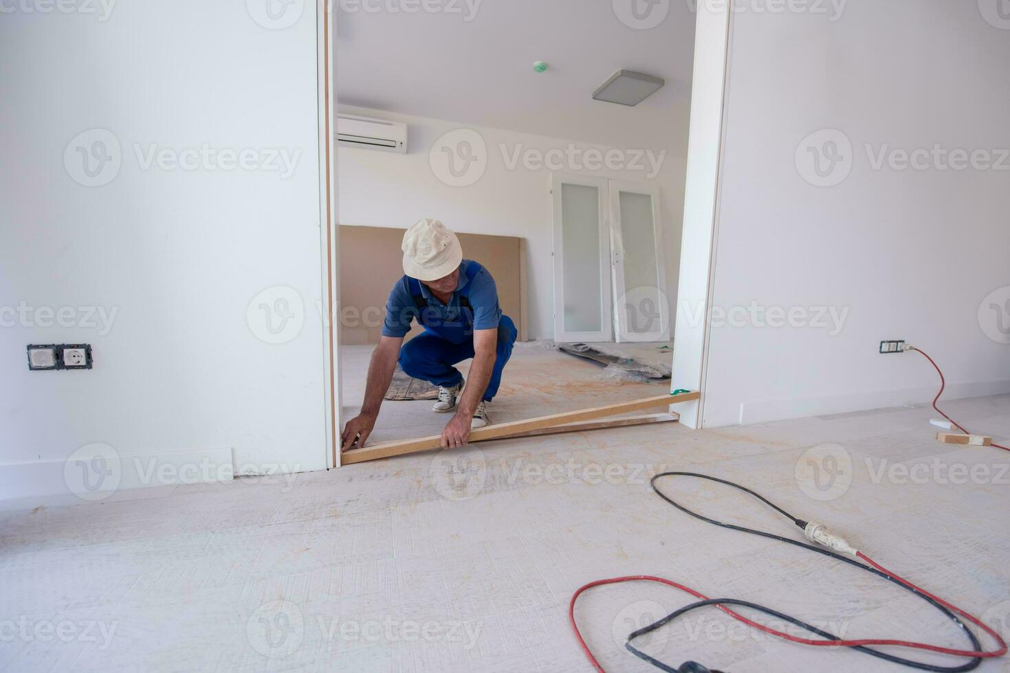 carpenters installing glass door with a wooden frame photo