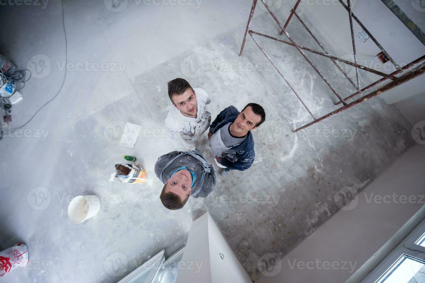 top view of Workers and builders with dirty uniform in apartment photo