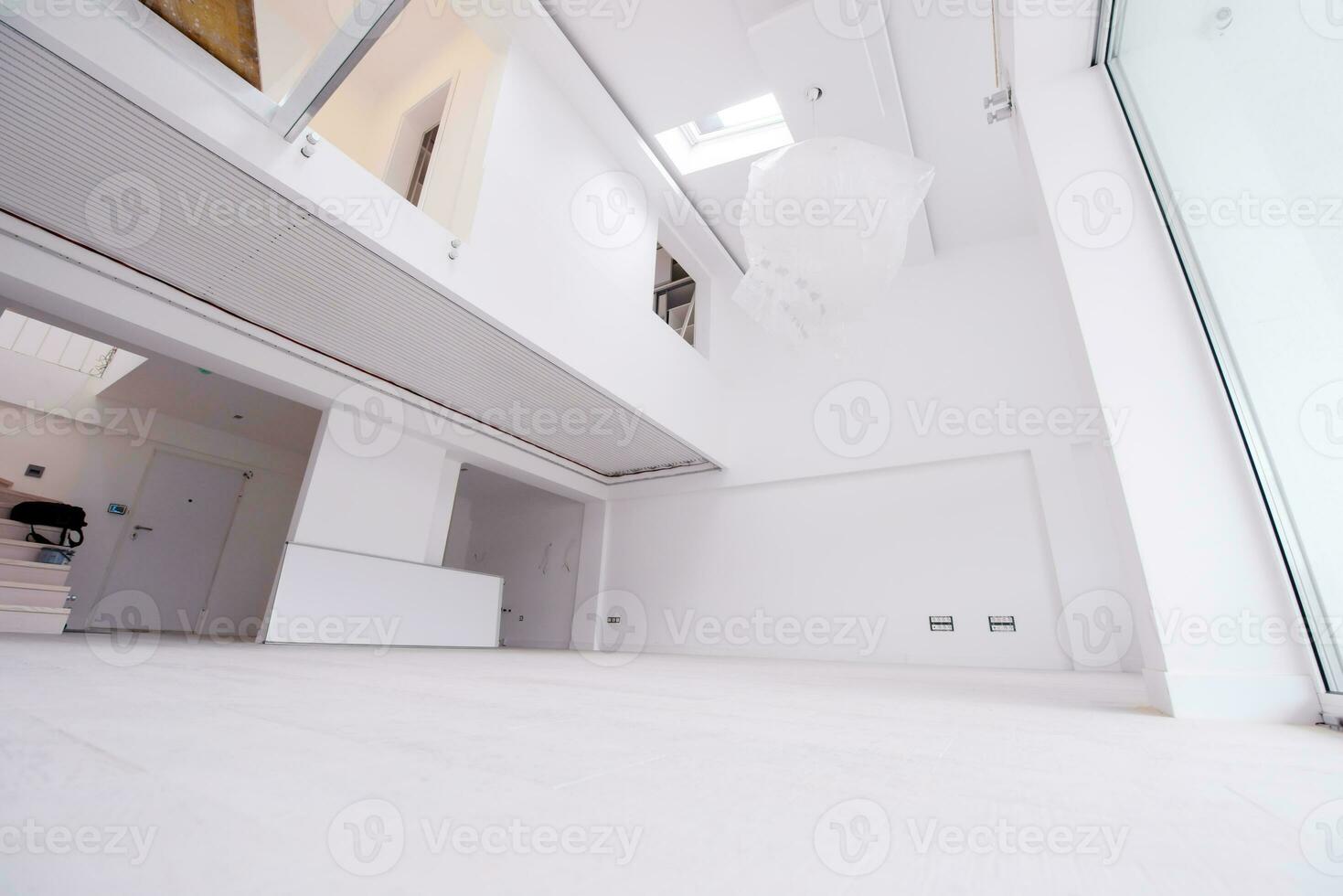 Interior of empty stylish modern open space two level apartment photo