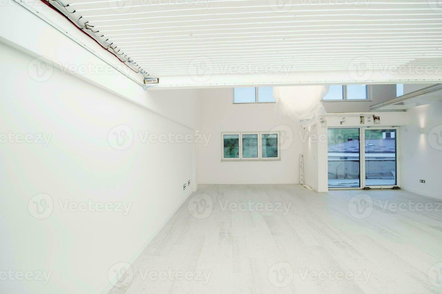 Interior of empty stylish modern open space two level apartment photo