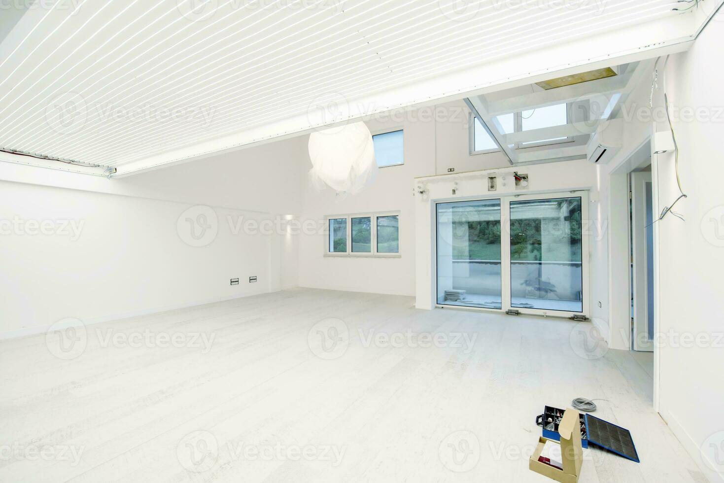 Interior of empty stylish modern open space two level apartment photo