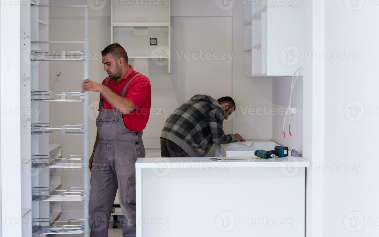 workers installing a new kitchen photo
