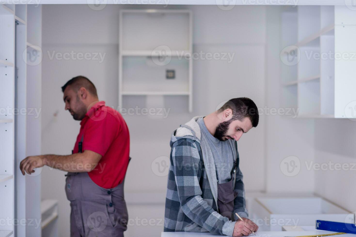 workers installing a new kitchen photo