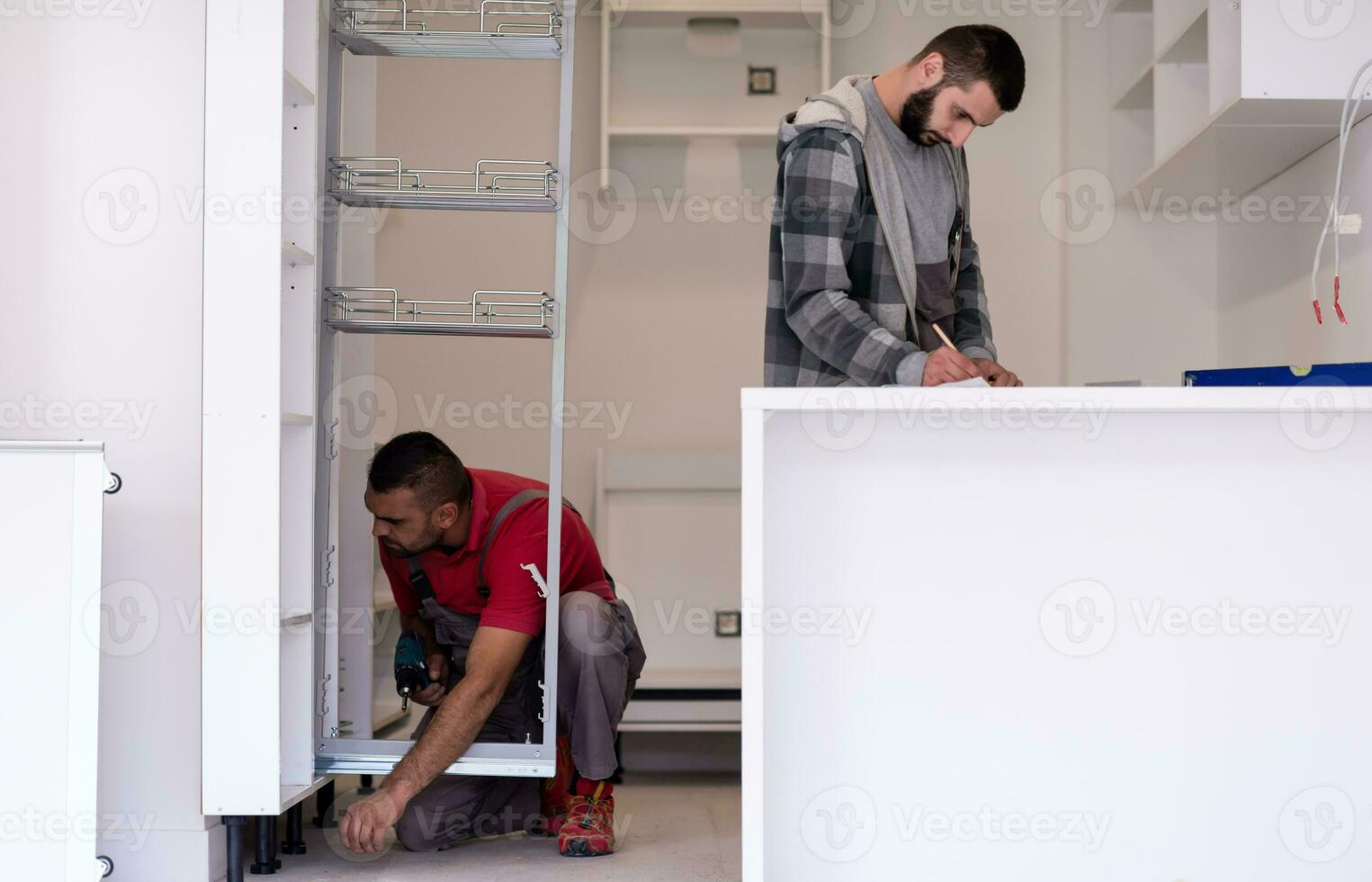 workers installing a new kitchen photo